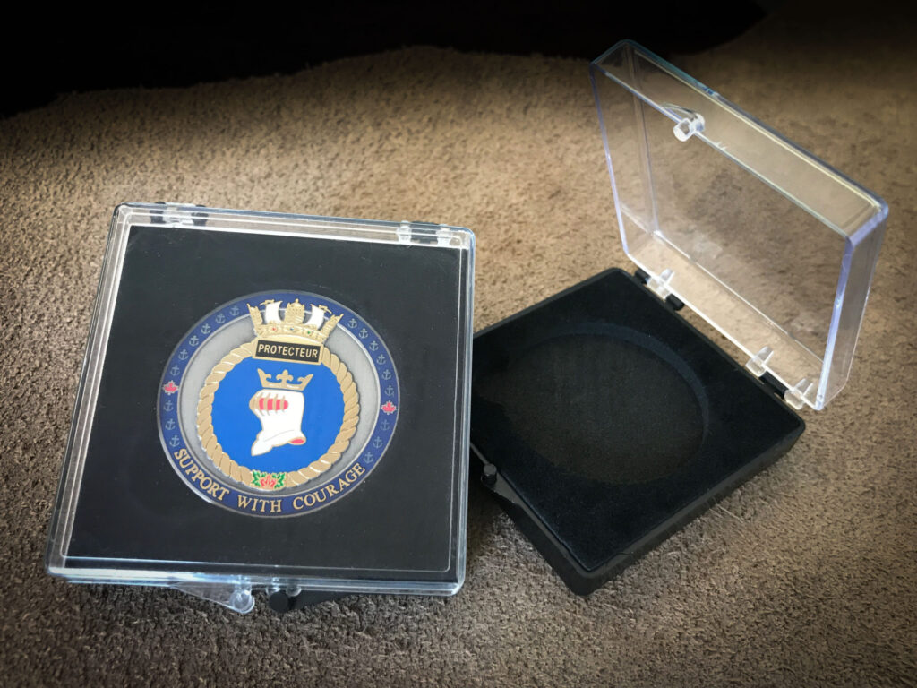 acrylic challenge coin case. This provides a low cost, yet classy, presentation package for challenge coins