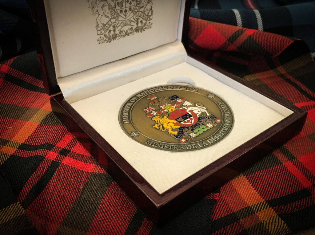 Canadian Chief of Defence Staff challenge coin in box.