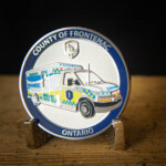 Polished nickel coin with Imitation Hard Enamel paint and screen printed blue Frontenac EMS challenge Coin Canada