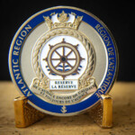 Polished Gold 2D coin with white soft enamel, blue and tan Imitation Hard enamel and screen-printed smaller text. Atlantic Region Reserve Force challenge Coin Canada